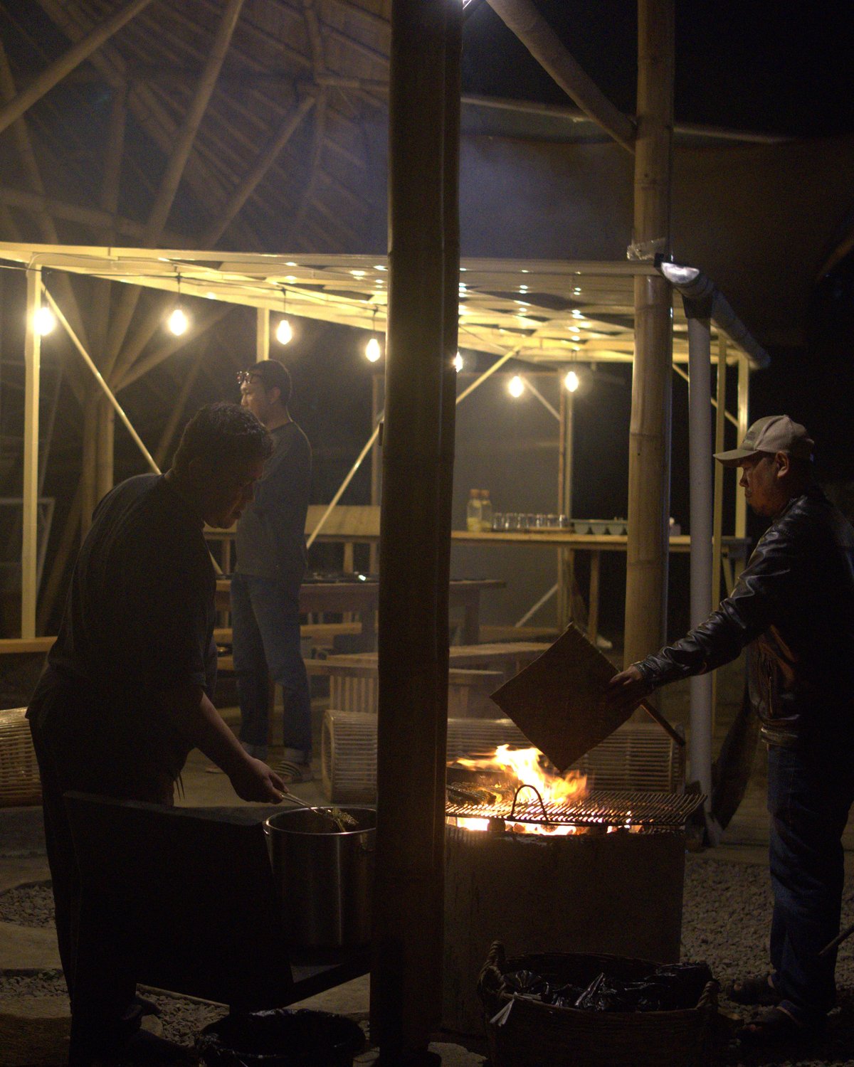Local workers gathered around the fire at night